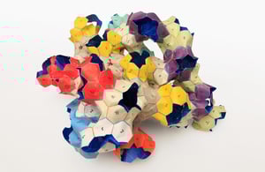 Geometric paper model illustrating the early conceptual origins of Spherene design.